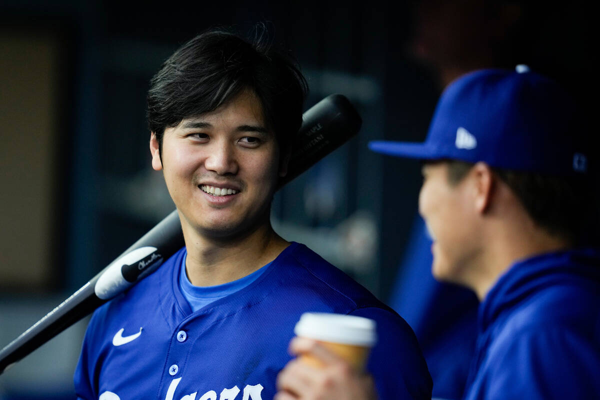 Los Angeles Dodgers designated hitter Shohei Ohtani, left, and relief pitcher Yoshinobu Yamamot ...