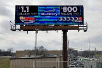 An electronic billboard advertises the Mega Millions and Powerball jackpots, Monday, March 25, ...