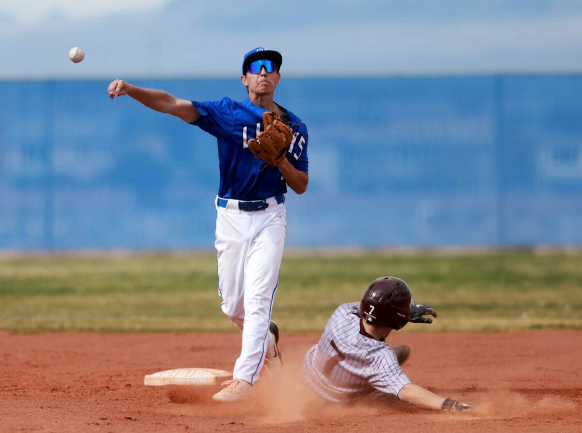 Sierra Vista Owen Angelo (30) turns a double play after getting out Cimarron-Memorial baserunne ...