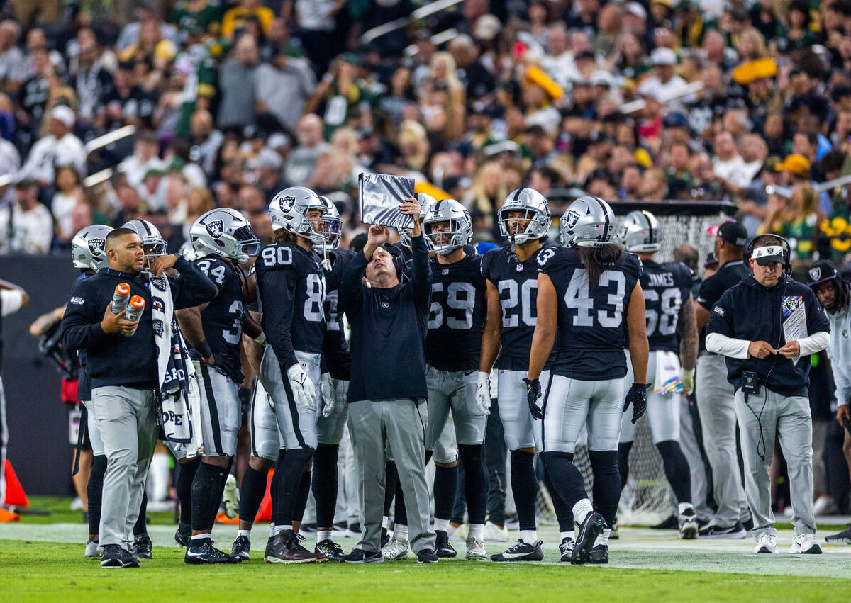 Raiders Special Teams Coordinator Tom McMahon talks strategy before a kickoff against the durin ...