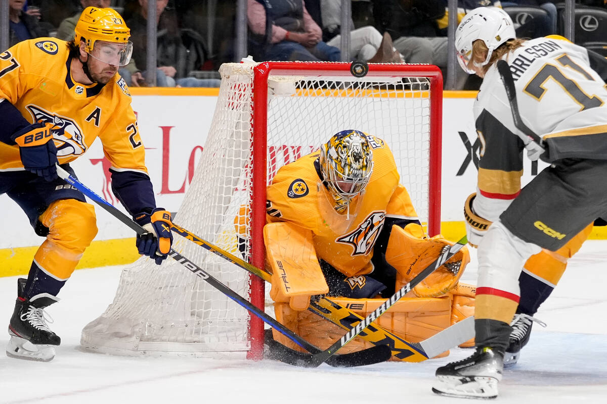 Vegas Golden Knights center William Karlsson (71) tries to get the past Nashville Predators def ...