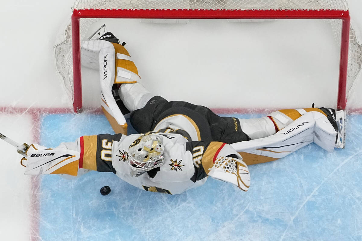 Vegas Golden Knights goaltender Jiri Patera (30) blocks a shot on goal during the first period ...