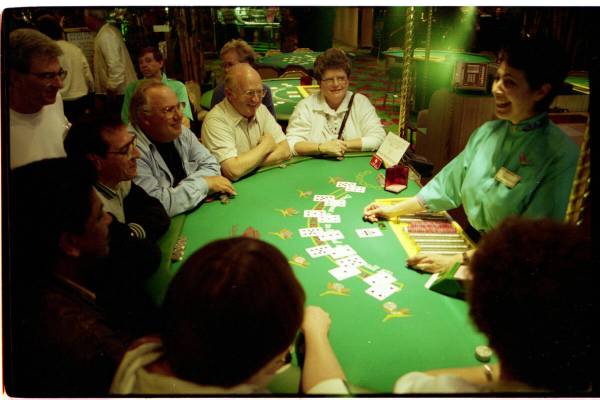 Christine Toly dealing "face-up" blackjack to tourists at the Tropicana Hotel's &quot ...