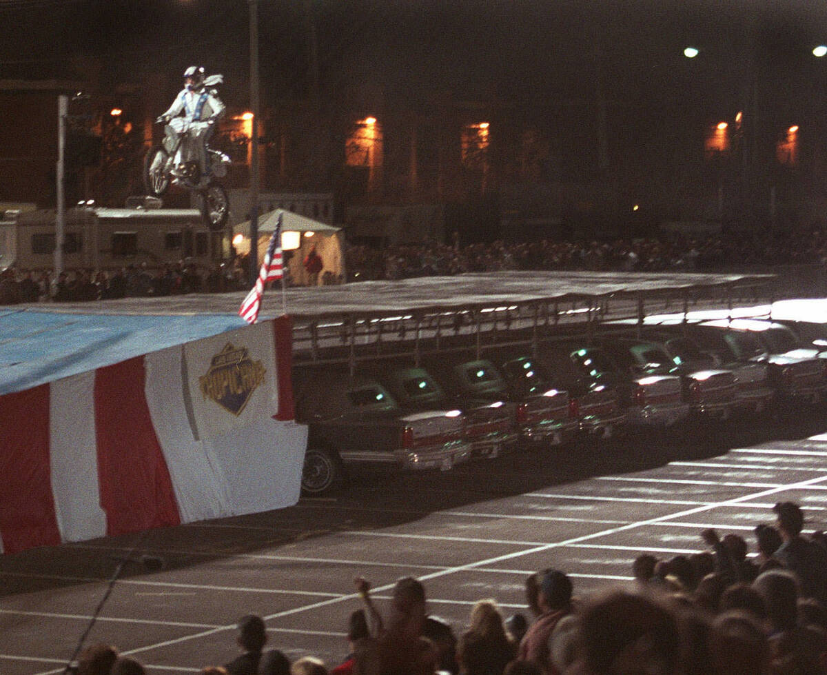 Robbie Knievel successfully lands after jumping his motorcycle over 30 limousines at the Tropic ...