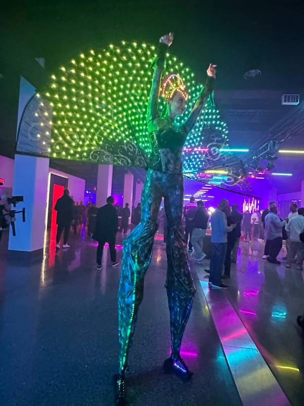 A performer entertains guests at the Las Vegas Super Bowl Host Committee media party at the For ...