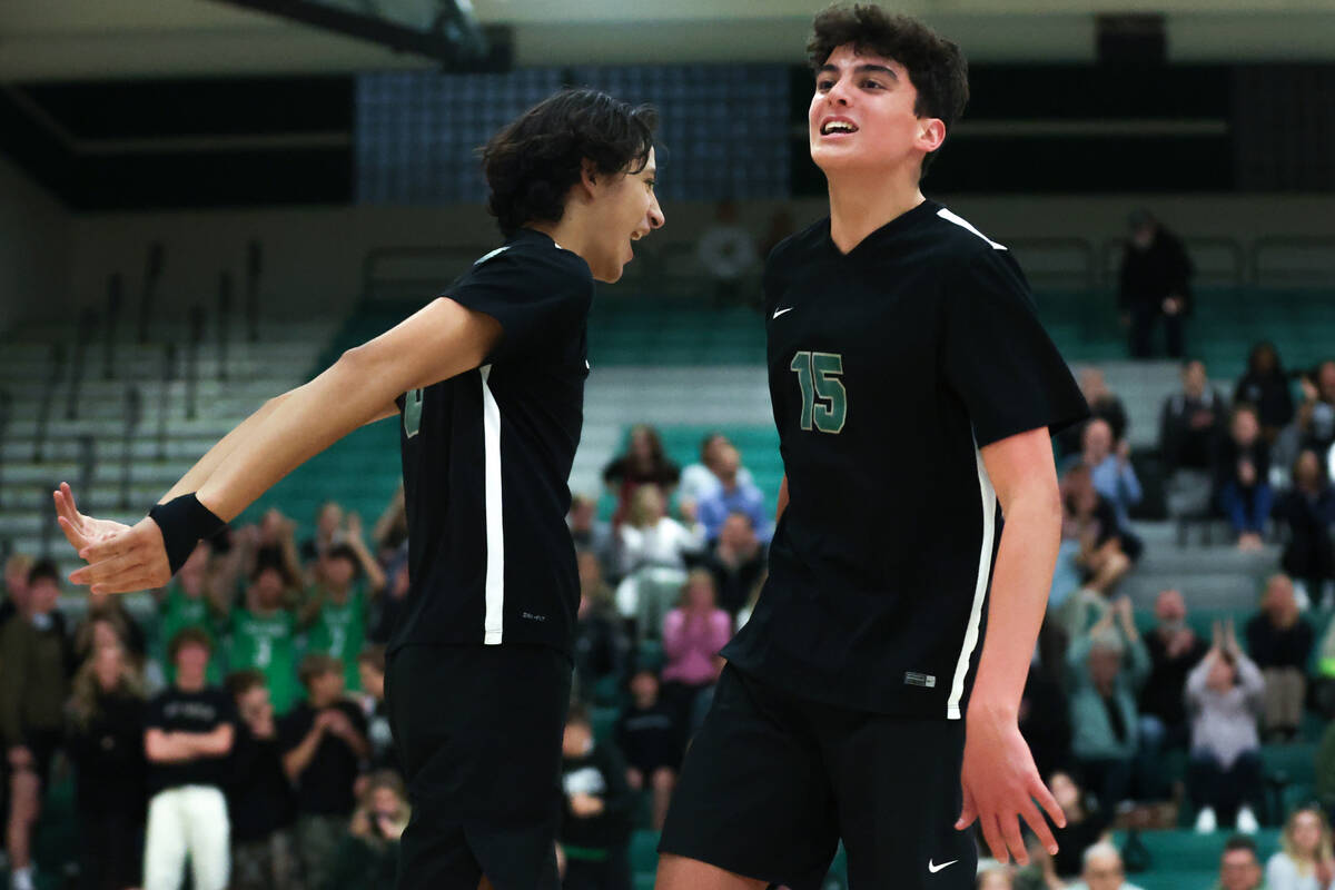 Palo Verde’s Tama Smeltzer, left, and David Bruce (15) celebrate as they win a boys high ...