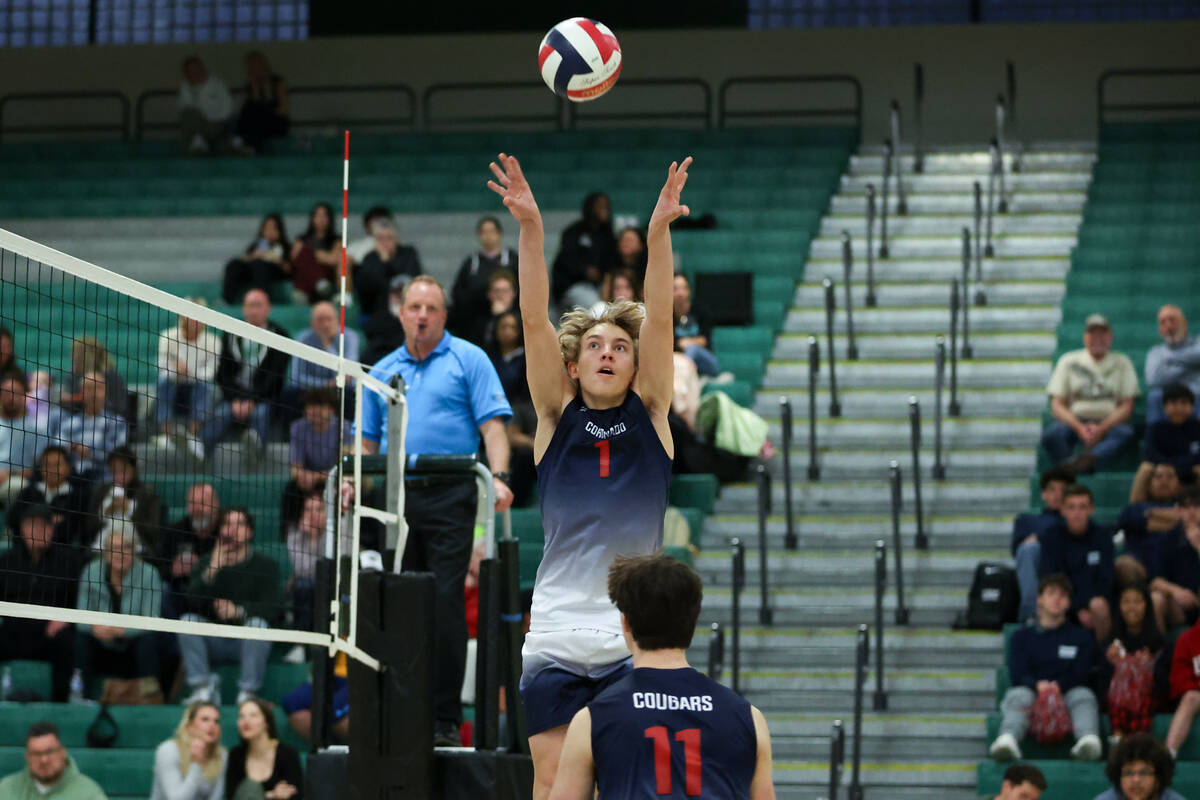 Coronado’s Braxton Rowley (1) sets his teammate up for a spike during a boys high school ...