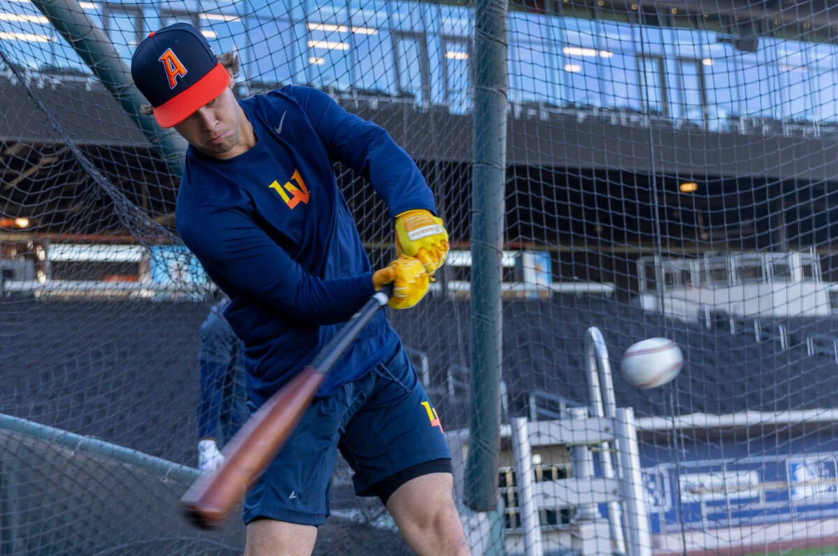 Aviators shortstop Max Muncy connects with a pitch while batting during practice at the Las Veg ...