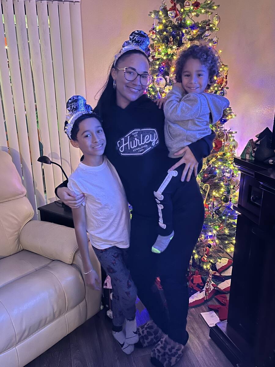 Malia Hoenshell, 29, and her two sons Zaiden Grandon, 9, and Phoenix Henley, 3, all of Henderso ...