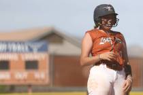 Legacy second baseman Rylee Madden (3) laughs at third base during a high school softball game ...
