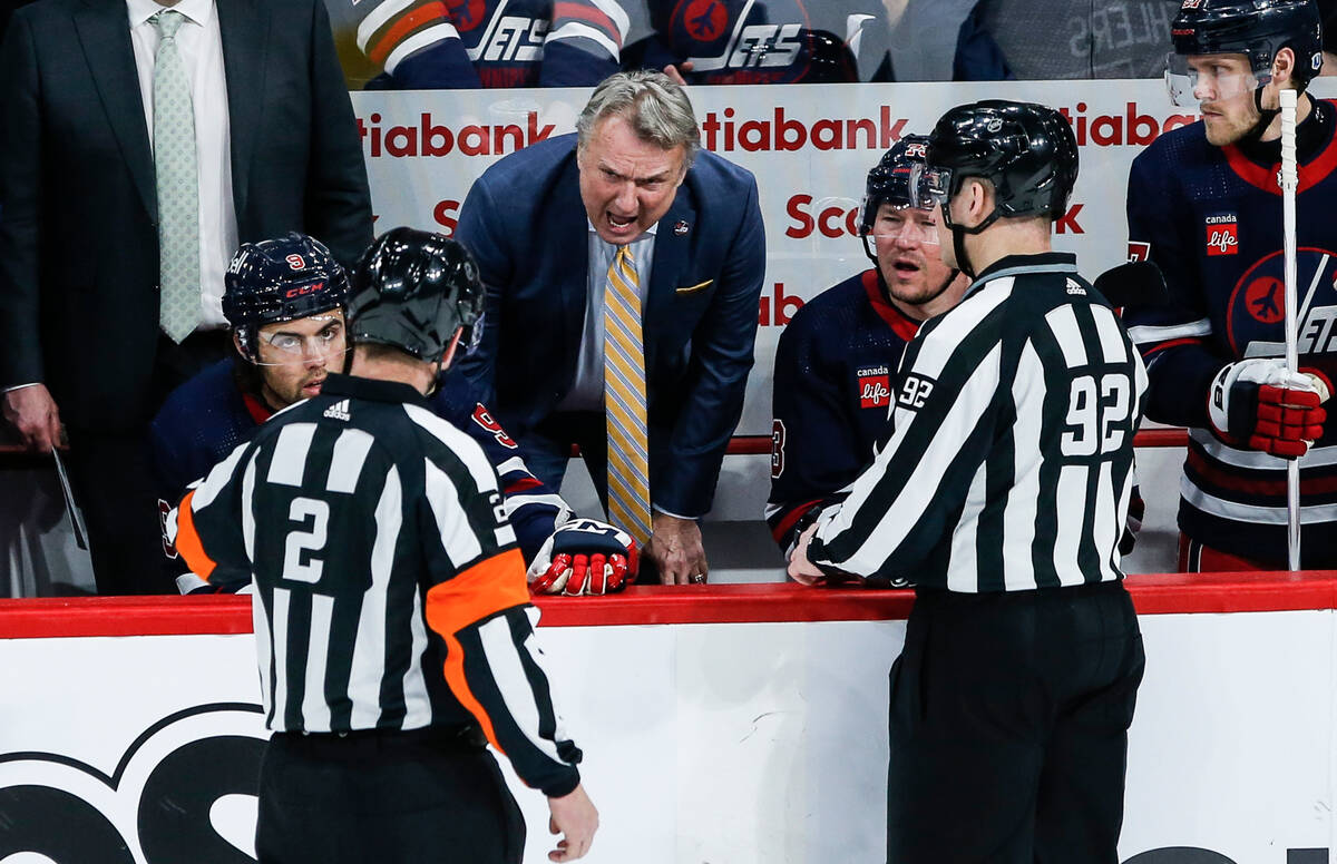 Winnipeg Jets head coach Rick Bowness questions a check on Vladislav Namestnikov by Vegas Golde ...