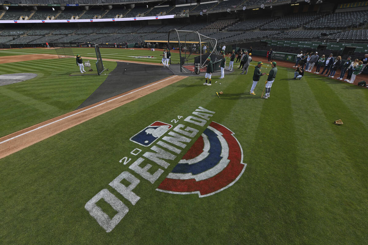 The Oakland Athletics take batting practice before opening day baseball game at the Coliseum in ...