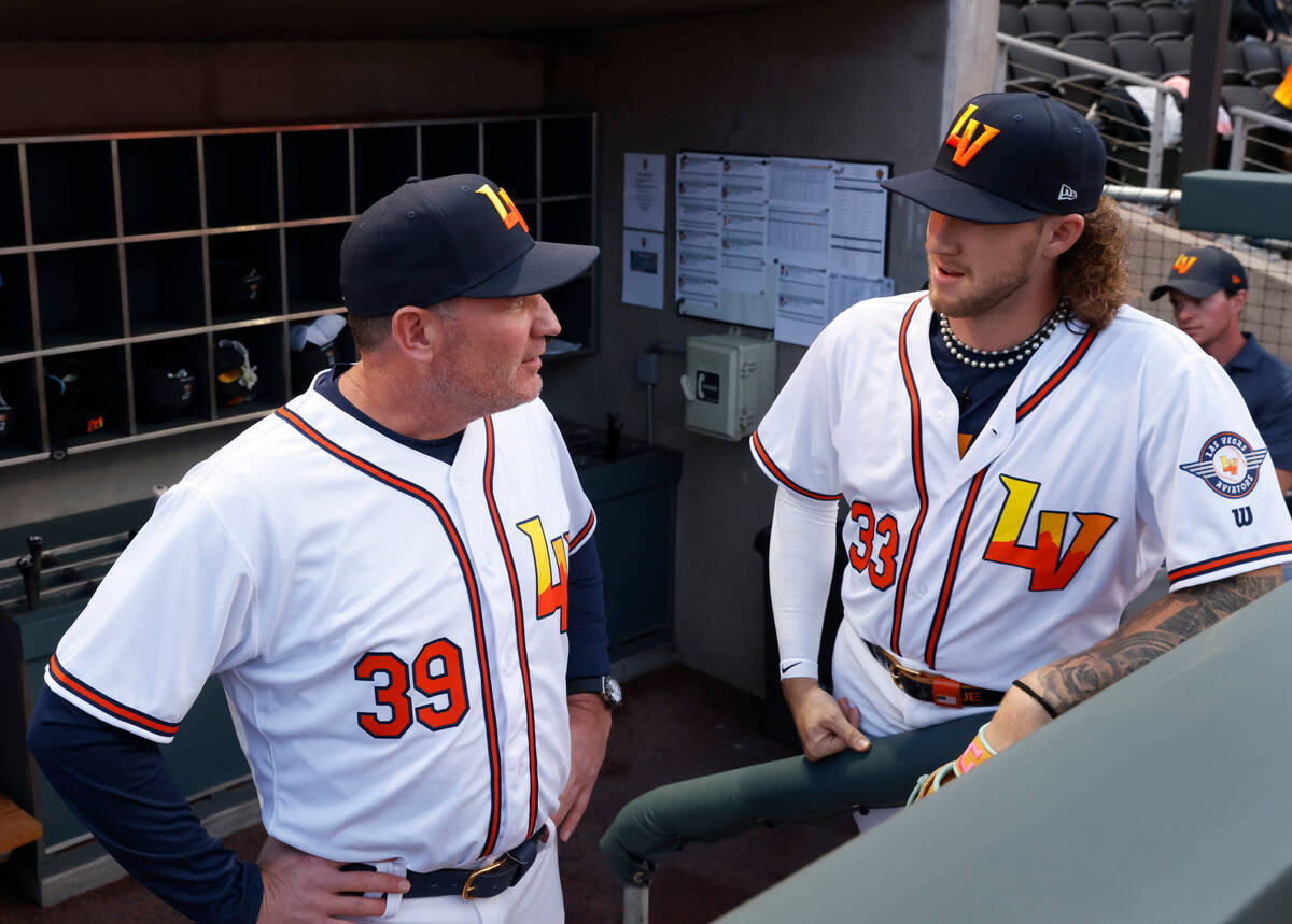 Aviators Manager Fran Riordan chats with pitcher Joey Estes prior to the home opener game again ...