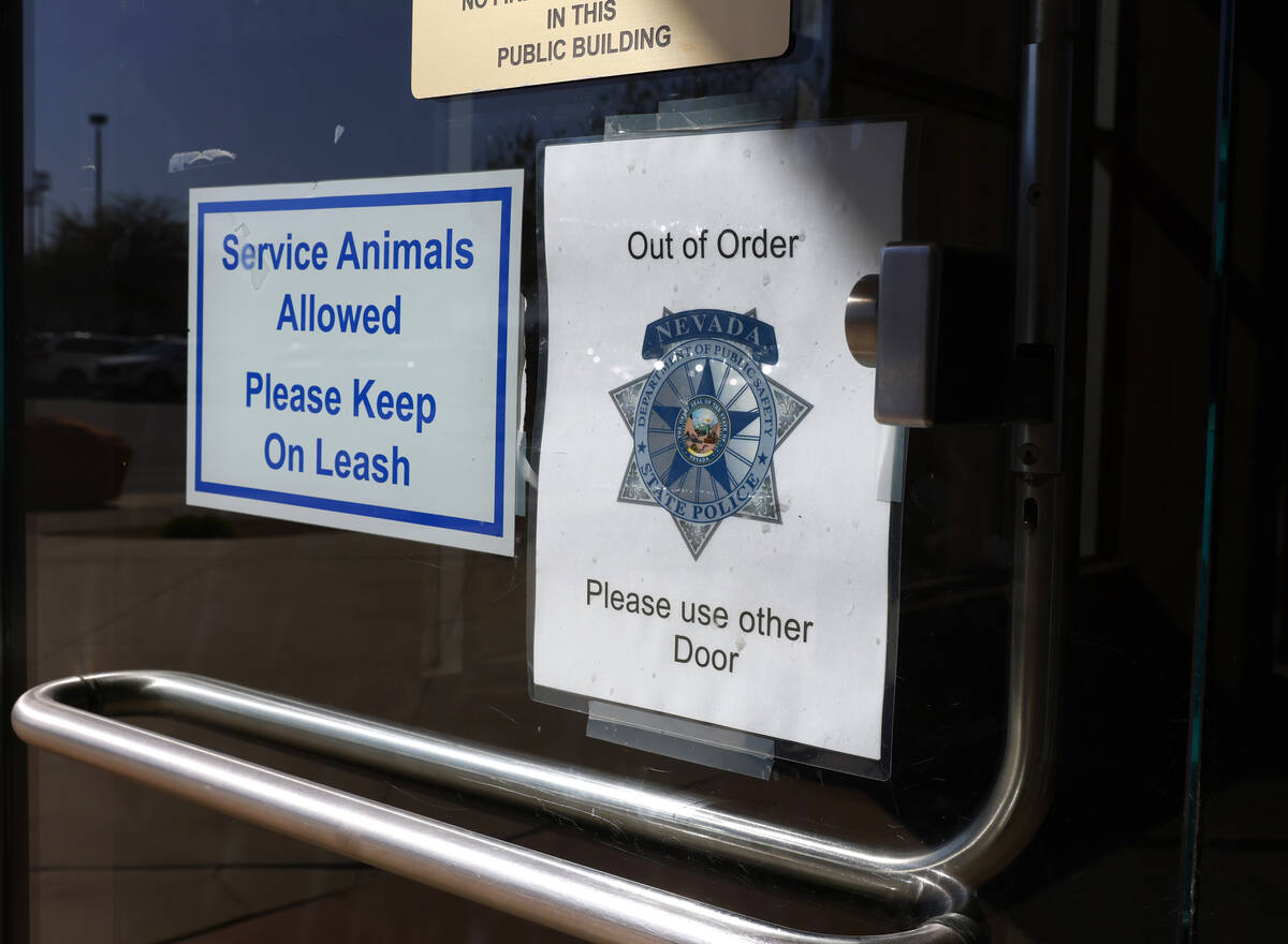 The out of order sign is posted on the main entrance of the Grant Sawyer state office building, ...