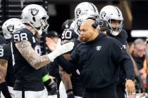 Raiders Interim Coach Antonio Pierce encourages his players on the sideline during the first ha ...