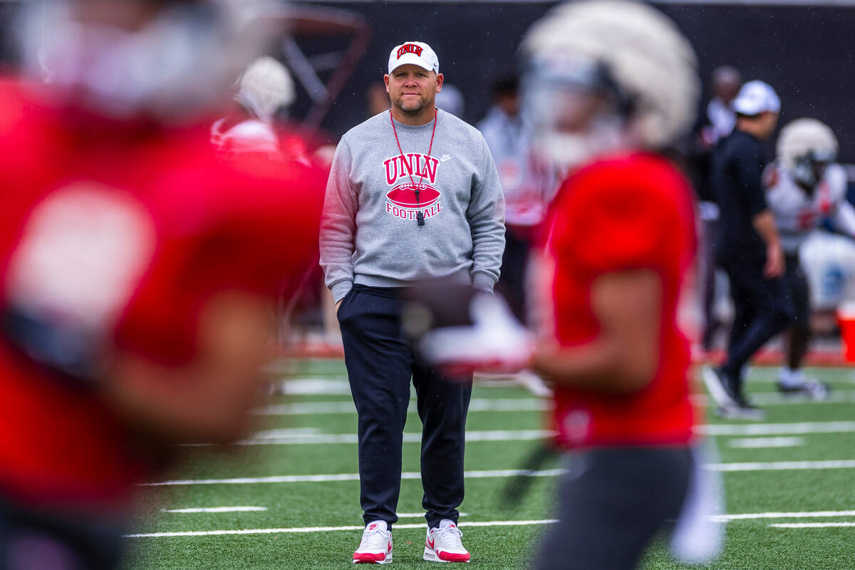 UNLV head coach Barry Odom observes his players during spring football practice at the Fertitta ...