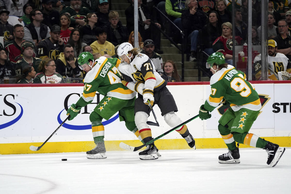 Minnesota Wild defenseman Declan Chisholm (47) and Vegas Golden Knights center William Karlsson ...