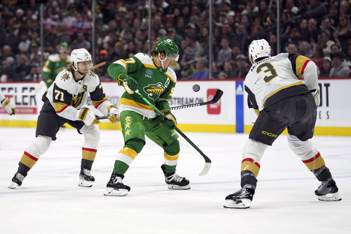 Minnesota Wild left wing Kirill Kaprizov, center, follows the puck as Vegas Golden Knights cent ...