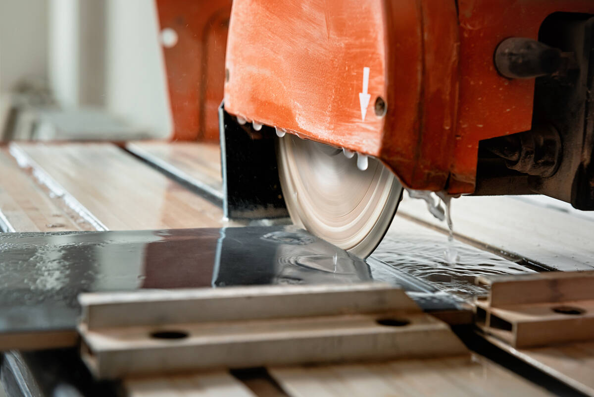 For professional-looking results, a wet saw is ideal for cutting tile. (Getty Images)