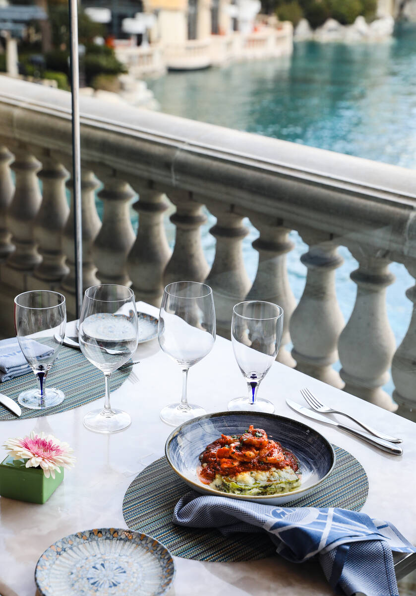 A table is set for lunch on the terrace at Lago, which overlooks the Lake and Fountains of Bell ...