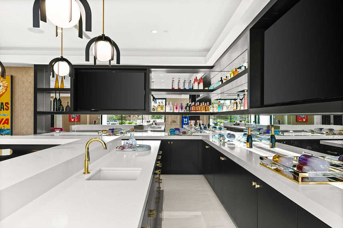 The large kitchen offers dark cabinetry. (IS Luxury)