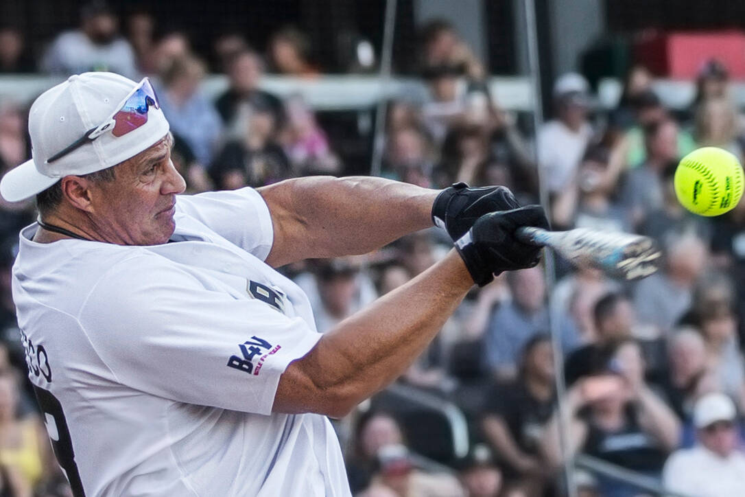 Jose Canseco takes a swing during the home run derby at the Battle For Vegas Charity Softball G ...