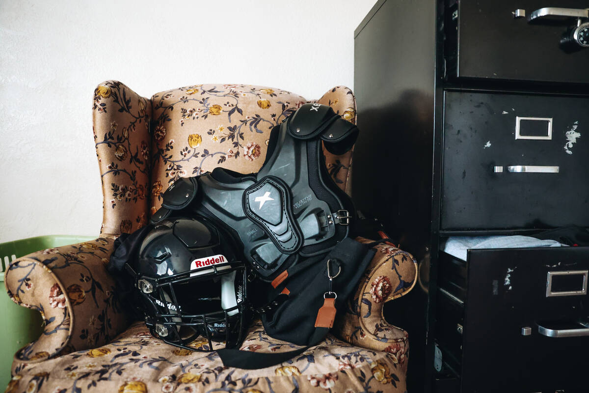 Girly Tambeagbor’s football gear sits on a chair in her room before a Las Vegas Silver S ...