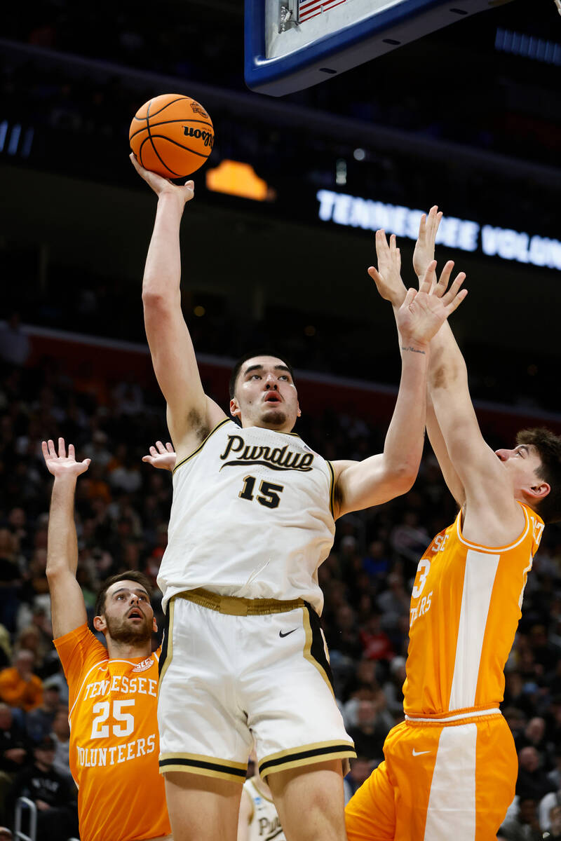 Purdue center Zach Edey (15) is defended by Tennessee forward J.P. Estrella (13) during the fir ...