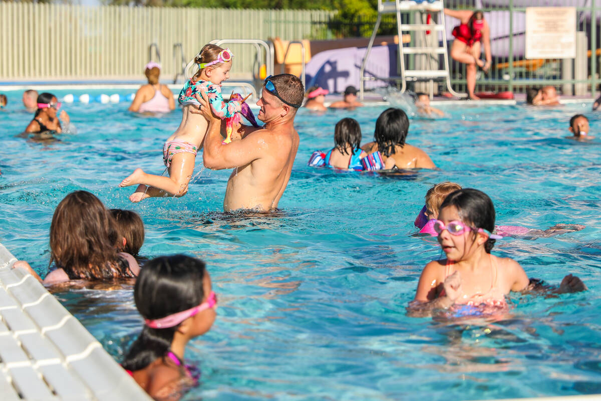 A large crowd of people came out to beat the heat at the Splash Back to School Party and School ...