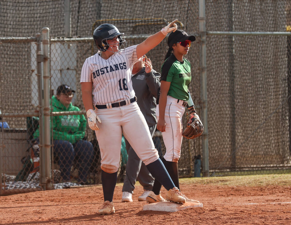 Shadow Ridge High School’s Madison Foster (18) gestures to her teammate after making it ...