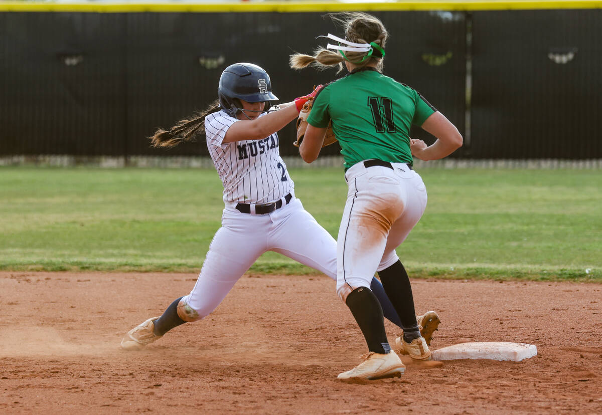 Shadow Ridge High School’s Carmella Garganese (2) reaches to make it safe to second base ...