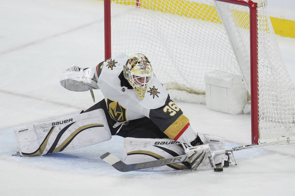 Vegas Golden Knights goaltender Logan Thompson (36) stops a shot during the third period of an ...