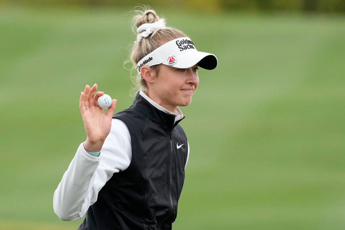 Nelly Korda waves to the crowd after making birdie at the 18th green during the final round of ...