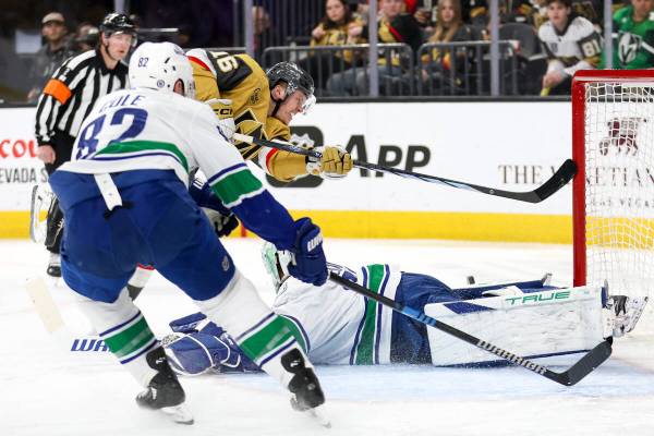 Golden Knights left wing Pavel Dorofeyev (16) shoots against Canucks goaltender Casey DeSmith, ...