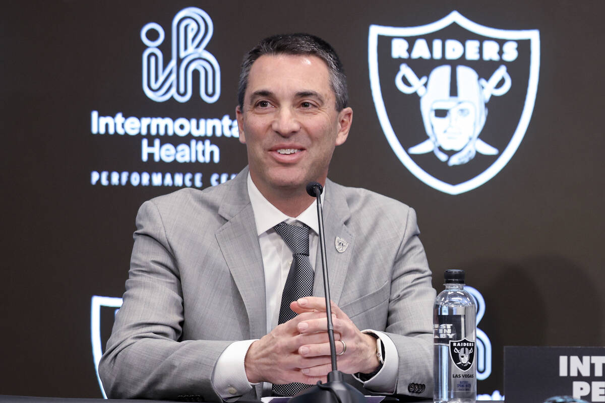 Tom Telesco, left, and Antonio Pierce are introduced as general manager and coach during a pres ...