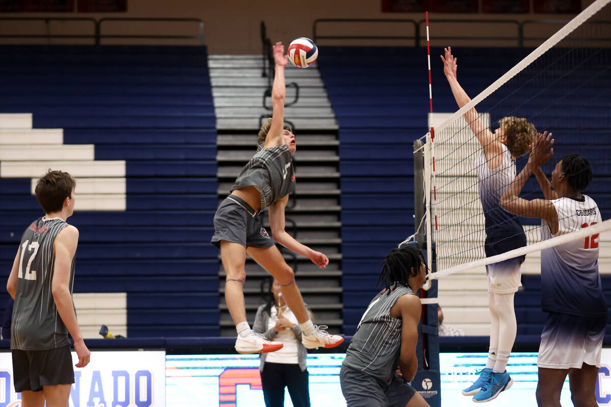 Arbor View’s Mark Blanchard spikes to Coronado during a boys high school volleyball matc ...