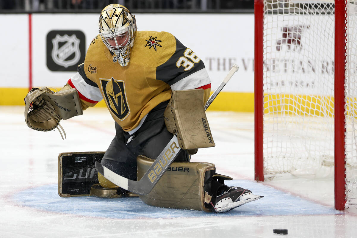 Golden Knights goaltender Logan Thompson (36) watches the puck after deflecting it during the s ...