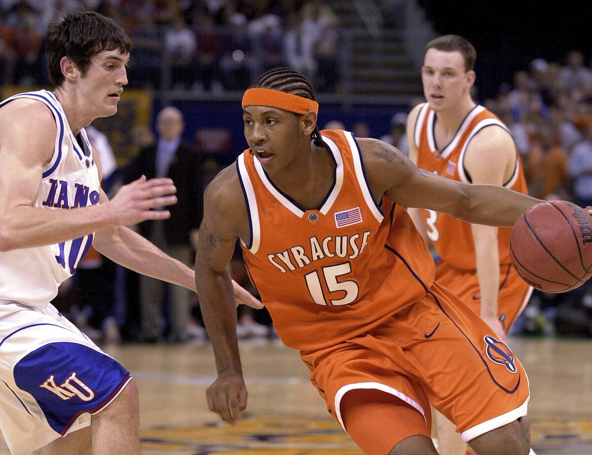 Syracuse's Carmelo Anthony (15) drives with Kansas' Kirk Hinrich (10) defending in the first ha ...