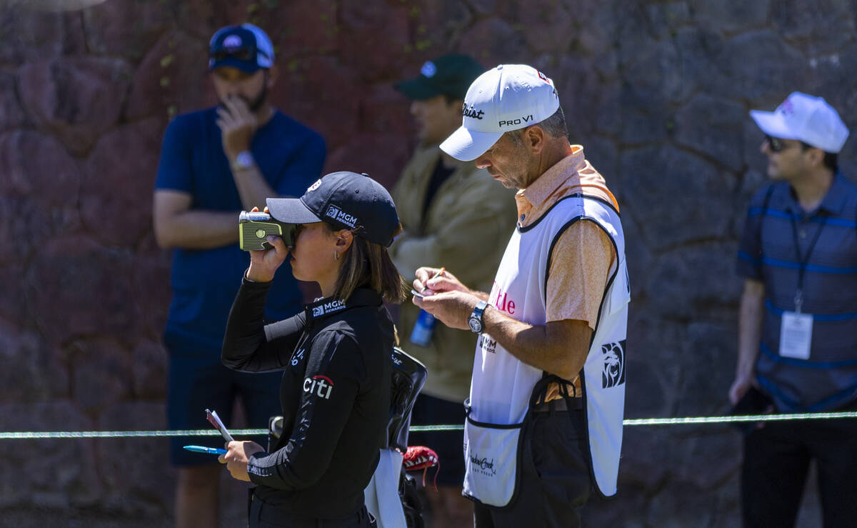 Danielle Kang checks the distance to the 8th hole during the first day of the LPGA T-Mobile Mat ...