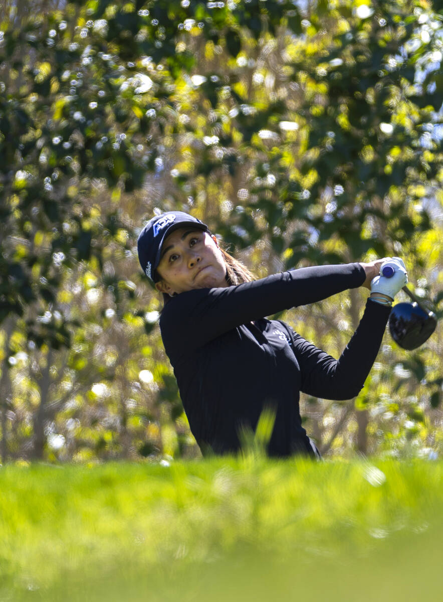 Danielle Kang watches her ball fly off the tee at the 9th hole during the first day of the LPGA ...