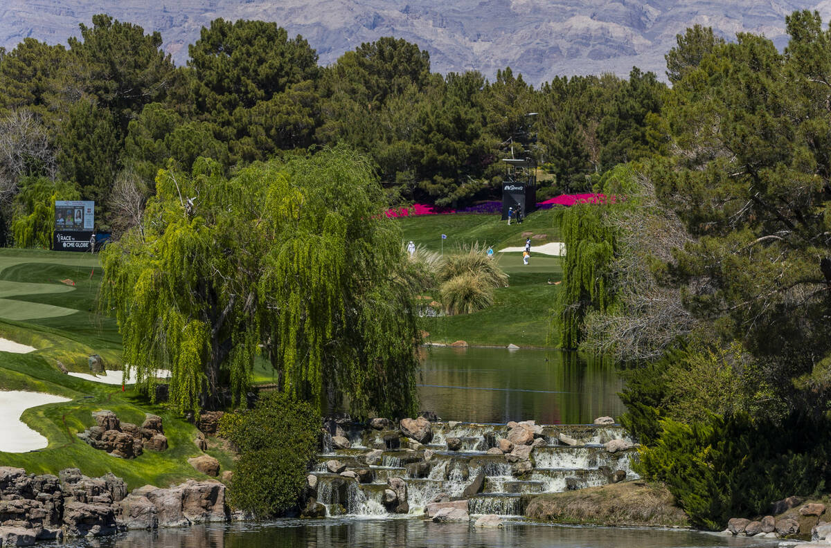 Golfers finish up amongst the scenic 18th hole during the first day of the LPGA T-Mobile Match ...
