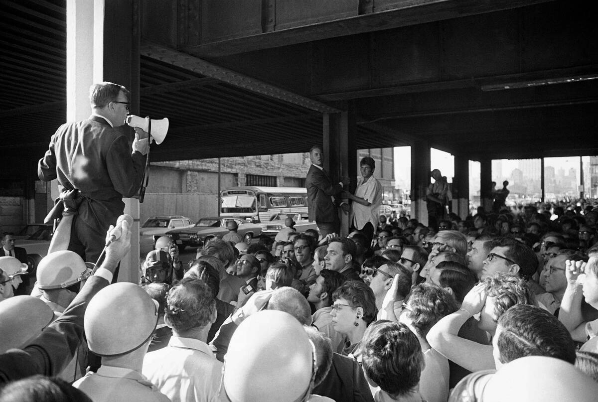 Donald Peterson, chairman of the Wisconsin delegation, talks to a group of protesting Democrati ...