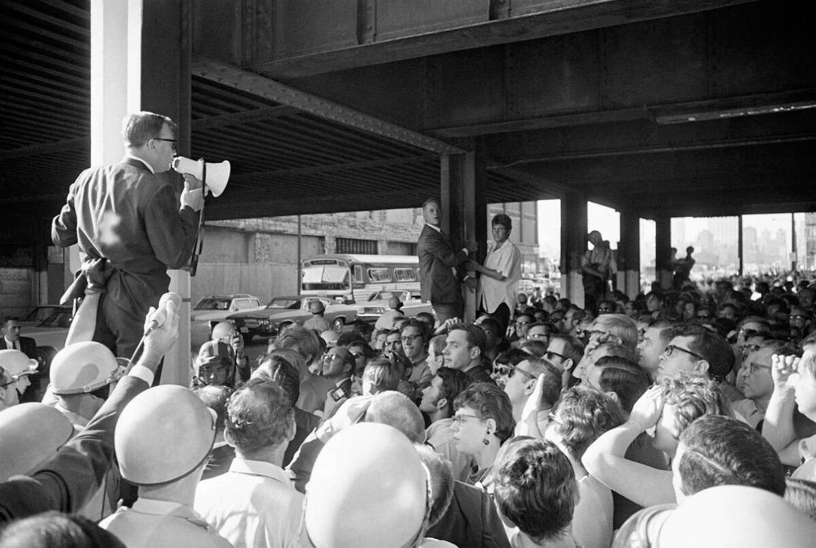 Donald Peterson, chairman of the Wisconsin delegation, talks to a group of protesting Democrati ...