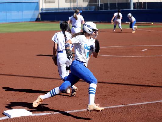 Green Valley baserunner Lyla Baxter (9) rounds third in the first inning of their softball game ...