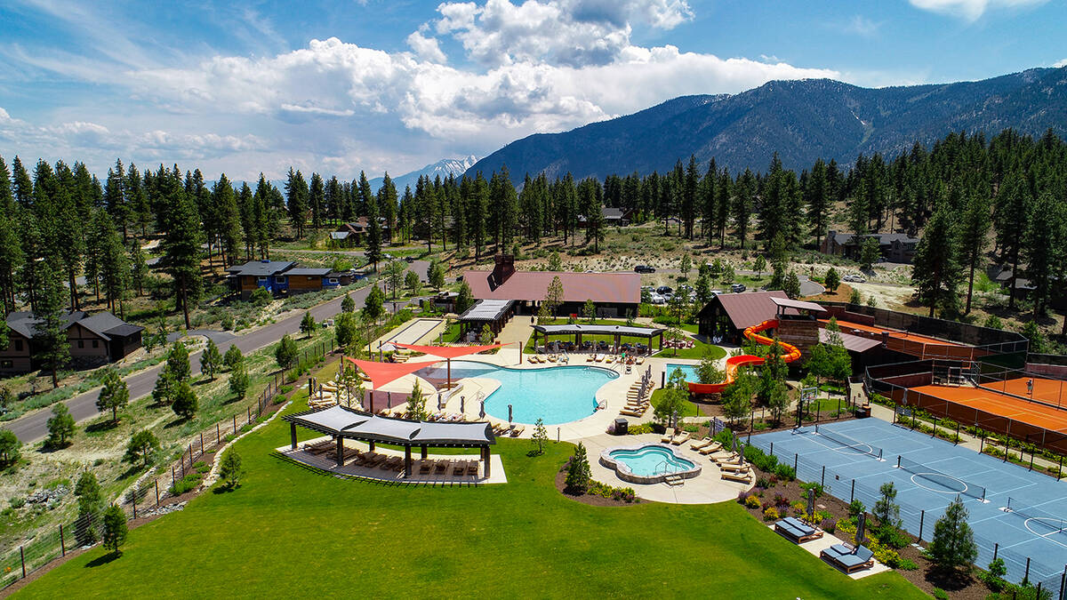 Summit Camp features a pool, hot tub and water slide crafted from 100-year-old timbers. It also ...