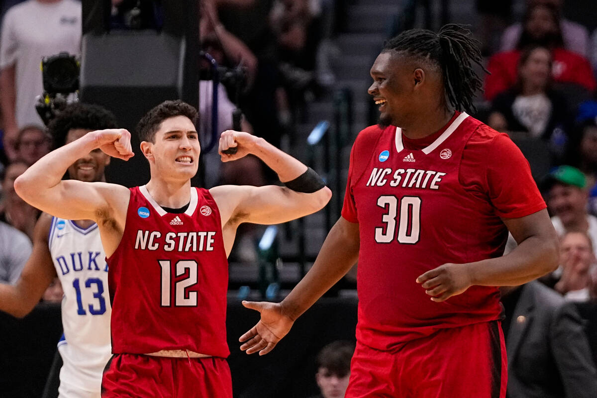 North Carolina State's Michael O'Connell (12) reacts after a basket by DJ Burns Jr. (30) agains ...