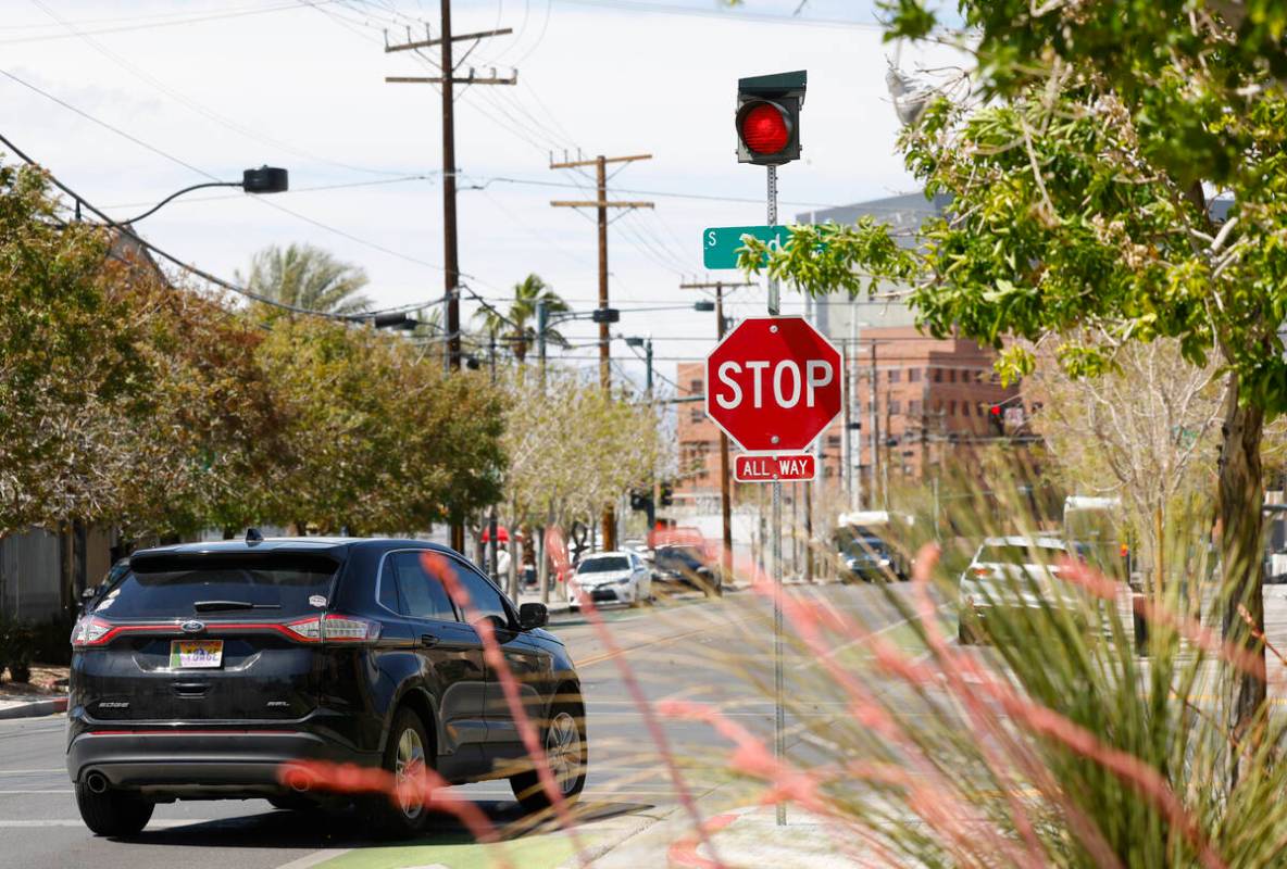 A motorist stops at Graces avenue where street signals recently added at the intersections of T ...