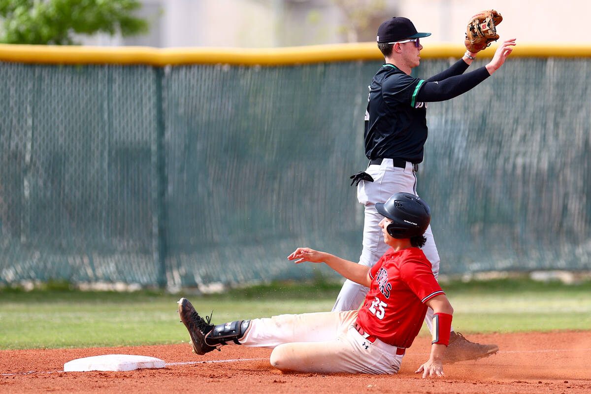 Las Vegas’ Dallas Martinez slides into home plate for a run while Palo Verde’s An ...