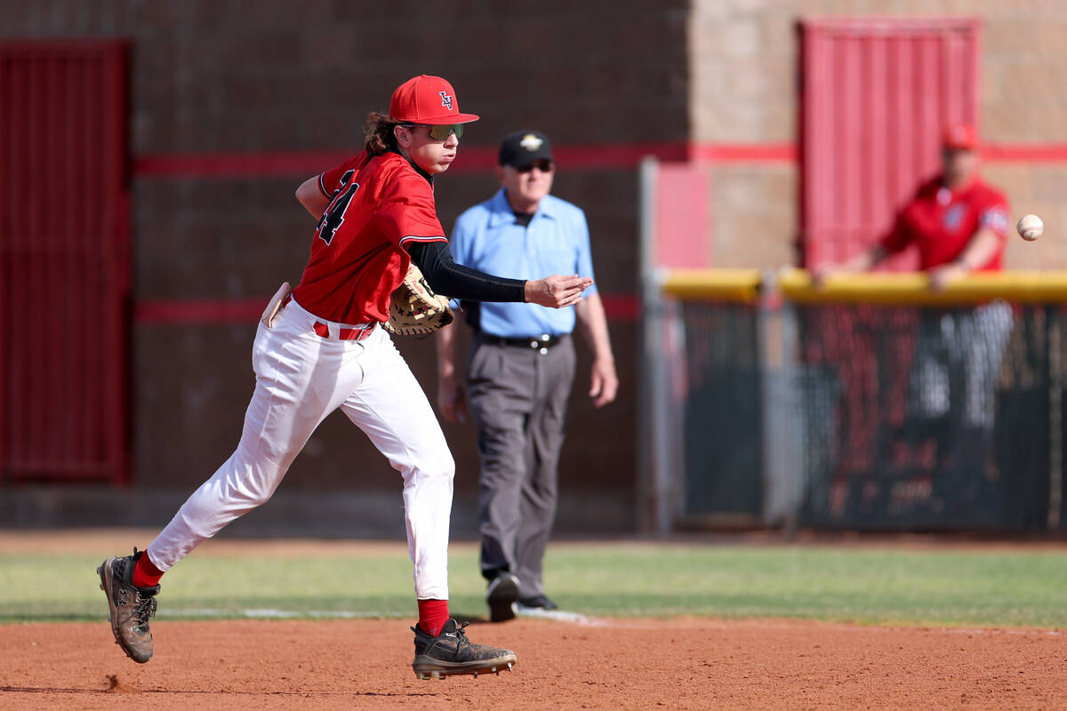 Las Vegas infielder Joseph Ponticello tosses the ball to first base for an out during a high sc ...