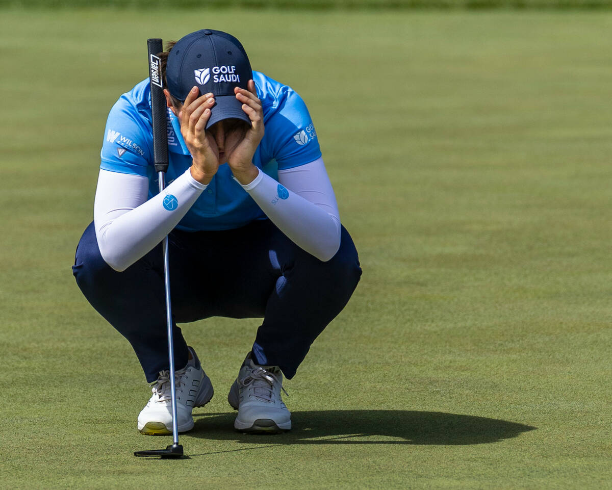 Carlota Ciganda concentrates on setting up her latest putt on the 14th hole during the second d ...